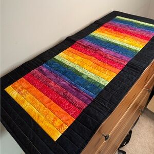 Handmade quilted table runner in rainbow pattern 🌈
